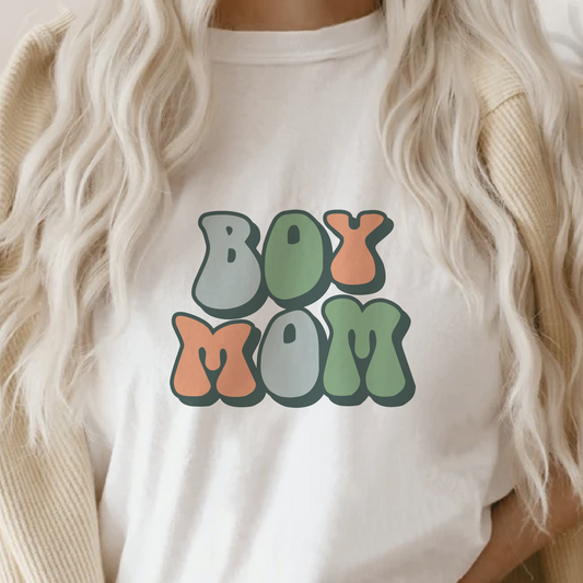 a woman wearing a t - shirt with the word boo mom printed on it