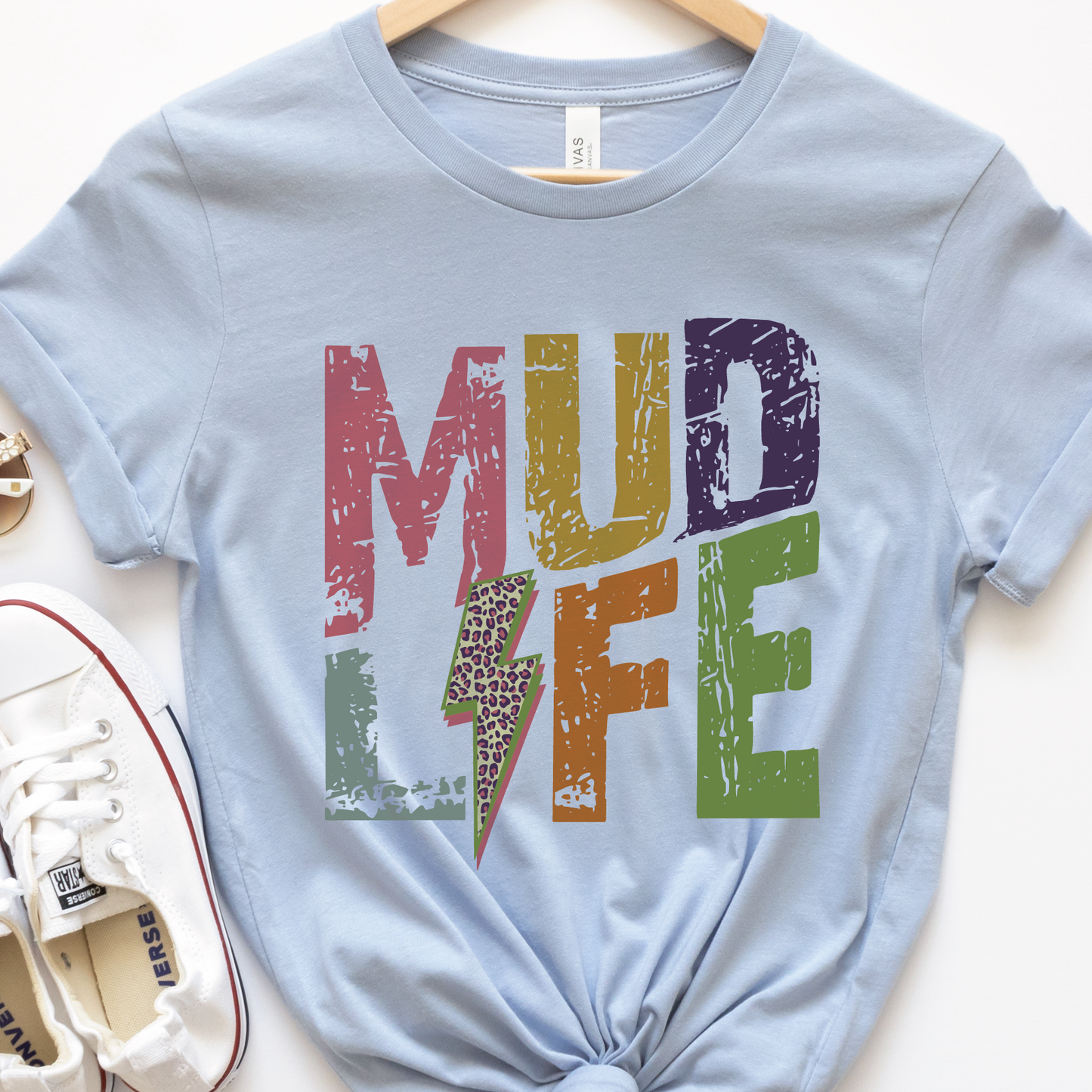 a t - shirt with the words mud life on it