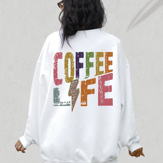 a woman wearing a sweatshirt that says coffee life