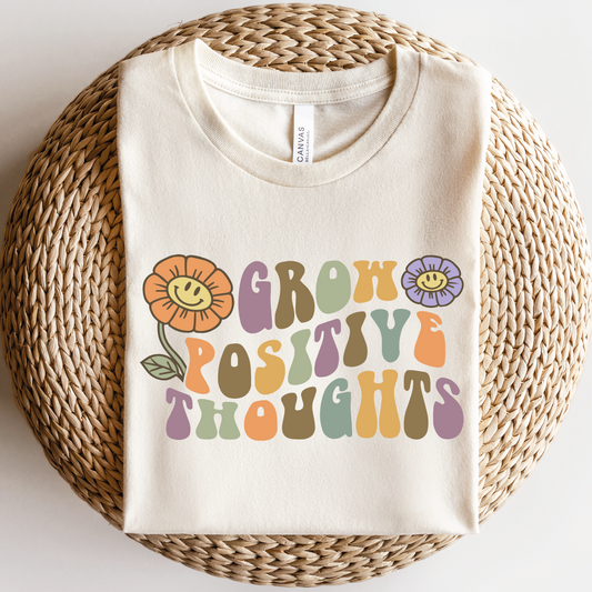 a t - shirt that says grow positive thoughts