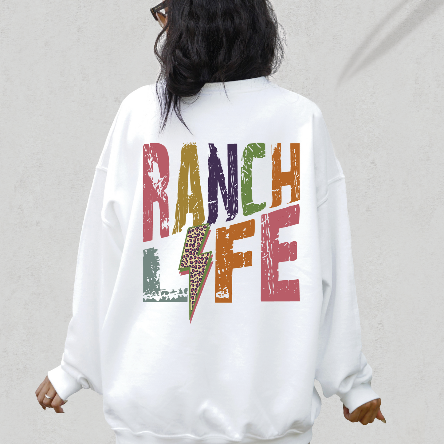 a woman wearing a white sweatshirt with the words dance life printed on it