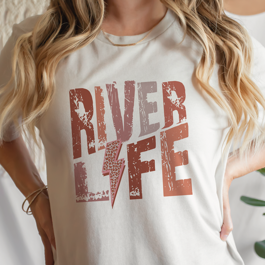 a woman wearing a river life t - shirt