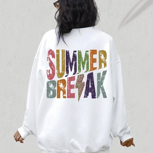 a woman wearing a white sweatshirt with the words summer break printed on it